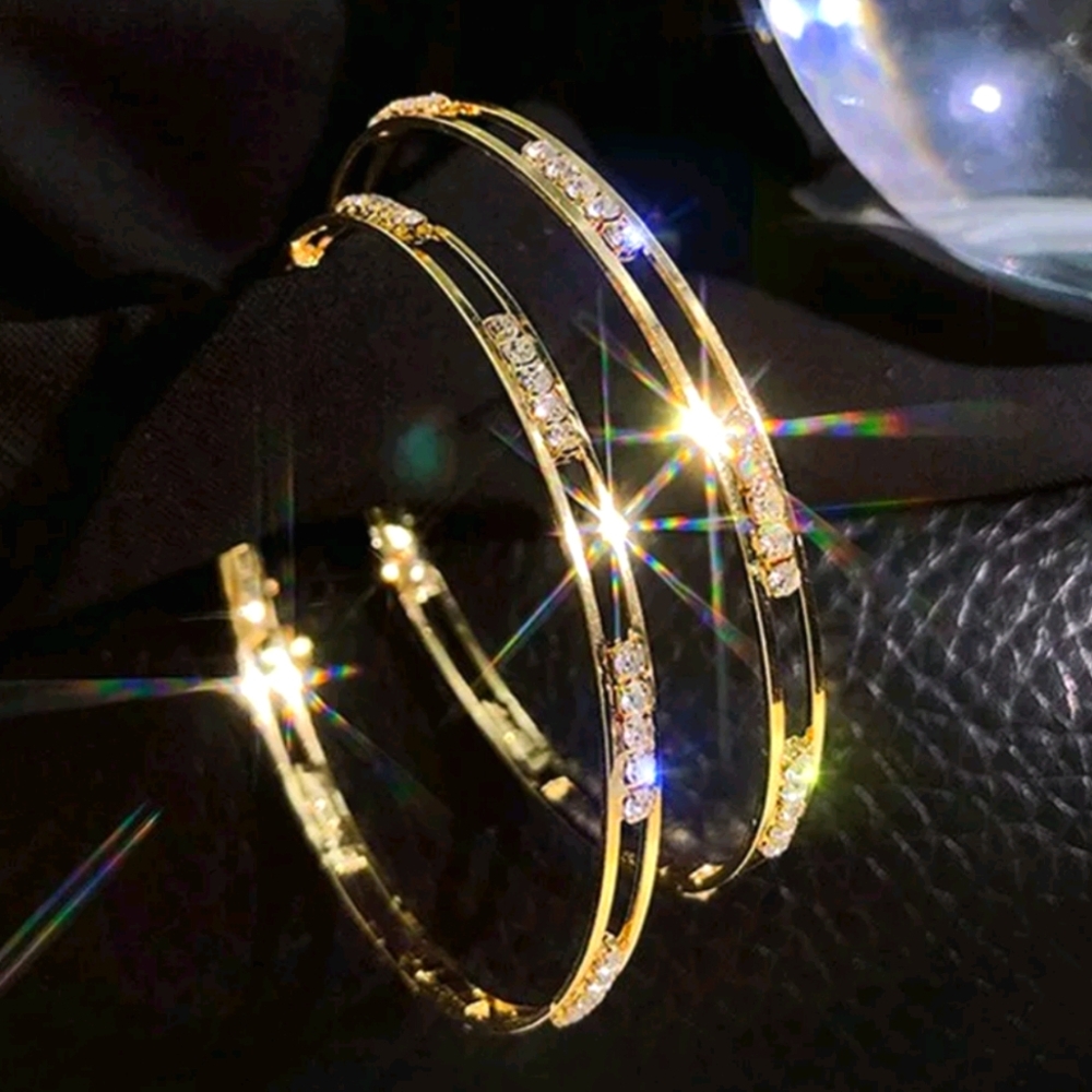 NIP gold hoop earrings aligned with diamonds